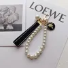 Designers Fashion Keyring Keychains Luxury Brands Pearl Handmade Keyrings Women Lovers Par Bags Cars Key Chains Lanyards233T