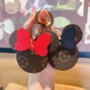 Chaveiro de cabeça de couro bonito da Minnie Chaveiro de carro de personalidade Tendência Bolsa de casal Pingente Pendurado Chaveiro