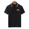 2023 T-shirt da uomo estiva in puro cotone con colletto alla coreana semplice lettera ricamata applique in cotone perlato con risvolto polo da uomo in bianco e nero M-3XL