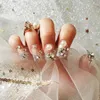 Unghie finte 24 pezzi finte con disegni di perle piene di diamanti indossano una toppa per manicure alla moda a lungo paragrafo premere su