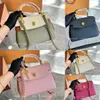 25 cm ￤kta l￤der Lockme Mini Bag Lady Tote Fashion Designer DrawString Underarm Bucket Cross Body P￥sar Kvinnor Handv￤ska Handv￤ska Luxury