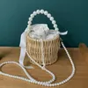 Kvinnor Designer axelväska Pure Knitting Bag Pearl Chain Handväska Böhmen Stil Summer Vacation Rattan Beach Väskor hinkväskor