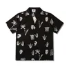 Mäns casual skjortor män överdimensionerade hawaiian strandskjortor sommar nya herr vintage skalle tryck svart kort ärmskjorta kemis homme luxe haute qualite z0224