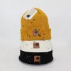 Agujeros de pintura unisex Reloj de acrílico Sombrero Gorro Gorro de punto de invierno Hombres mujeres Diseñador de lujo Casual Deportes al aire libre Jersey cálido Gorro de lana con calavera Gorros de esquí