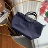 고품질 도매 나일론 핸드백 메신저 95% 할인 된 두꺼운 가방 디자이너 BOLSAS 여성 목질 BOLSAS 가죽 접이식 토트 방수 LC SAC