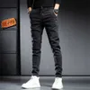 Мужские джинсы весна лето черные серые грузовые джинсы мужская уличная одежда для джинсовой джинсовой брюки мужчины мешковатые гарем джинсовые брюки грузовые брюки Мужские джинсы Z0225