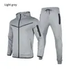 Mens Trailtsits Yeni Marka Sporları Ceketler Zip Hoodie ve Pantolon Moda Birleştirme Pamuk Streç Egzersiz Giysileri Premium Giyim Z0224