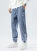 Mäns jeans vårhöst plus size baggy jeans män hip hop streetwear harem byxor mode broderi stretch bomull casual jogger jeans 8xl z0225