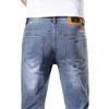 Marca de moda de jeans de jeans masculina Jeans Spring Masculk Novo pé elástico esbelto use calças azuis brancas 6SVC