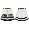 Shorts masculinos 2023 Marca de moda Rhude primavera Summer Summer Summer masculino Letra bordada Ribbon Casual calças soltas.