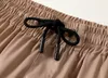 Pantalones cortos de diseñador oficiales del mismo estilo para hombres y mujeres Ropa de calle de moda de verano Traje de baño de secado rápido Pantalones de playa de tablero impreso talla s-3XL #GUUU