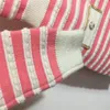23SS Robes de créateurs pour femmes Col en V Chemises en tricot Robe avec boutons en cristal Filles Milan Runway Débardeur A-ligne Robes à manches longues rayées Chemise pull haut de gamme