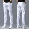 Mäns jeansdesigner 2023 Spring and Summer Jeans Men's Light Luxury Korean Version Thin Elastic Slim Cotton Pure White Pants L9zy