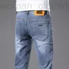 Marca de moda de jeans de jeans masculina Jeans Spring Masculk Novo pé elástico esbelto use calças azuis brancas 6SVC