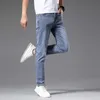 Marca de moda de jeans de jeans masculina Jeans Spring Masculk Novo pé elástico esbelto use calças azuis brancas 6SVC