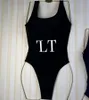 Lyxhemtextil halter simning dräkt kvinnor bikini sexig slitage kvinnlig ihålig monokini svart baddräkt vadderad simning solid bodysuit med