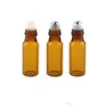Parfymflaska 5 ml Amber tomt glashänge prov per med stålrullkulskulflaskor Small Promotion Oil Drop Delivery Health Beauty Dhhby