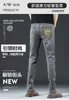 Jeans para hombres Diseñador Marca de moda europea Pantalones de mezclilla gris Primavera y verano Casual Elástico Slim Fit Pierna pequeña Recortada Luz de lujo Ropa de hombre GQO1