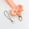 Клавные Bowknot Girl Keychain Lanyard Mobile Phone Anti-Lost Universal Pass и разрешение на работу долговечна модным