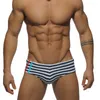 Mutande Uomo Sexy Under Wear Biancheria intima gay Slip da passerella Costume da bagno da uomo Mutandine da bikini a vita bassa Nylon