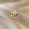 韓国のファッションクリスタルハート銅ジルコンレディースウェディングリングフローラルパール幾何クロスシンプルゴールド調整可能なダイヤモンドリング