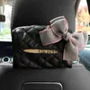 Nouveau mignon Bowknot siège de voiture appui-tête suspendu tissu support de la boîte multi-fonction en cuir papier tour organisateur style voiture accessoires