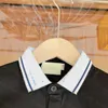 23SS Toddler Tee Çocuk Tasarımcısı Tişört Çocuk Tshirt Erkek Kız Kızlar Patchwork Mektubu Dokumalı Çizgili Yakası Kısa Kol Polo Gömlek Yüksek Kaliteli Çocuk Giysileri