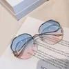 Nouvelle mode grand cadre sans monture bord coupé lunettes de soleil femme polygone métal Arc miroir jambe Net rouge lunettes de soleil