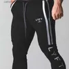 Pantalons pour hommes Printemps et Automne Nouveaux pantalons de jogging Hommes Sports Gym Fitness Pantalons Hommes Coton Blanc Clip Bande Impression Mode Casual Collants T230602