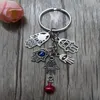 50st Fashion DIY KeyChain 25mm Key Ring Turkiet Blue Evil Eyekabbalah Fatima Hamsa Hand Bell Charms Keyring Decorative Bag Gift288Z