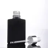 Bouteilles de stockage 200 pièces en gros personnalisé 30 ml noir mat carré Rectangle flacon compte-gouttes en verre pour huile essentielle 1 oz