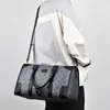 Designers Mode Sacs Duffel Hommes de luxe Femmes Femmes Sacs de voyage en cuir grande capacité fourre-tout porter des bagages pendant la nuit sac de week-end