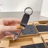 Cartera de diseñador superior Monedero corto para hombre de cuero de alta calidad impreso 2 Clip de dinero plegable Regalo de tapa dura clásico 3 en 1 conjunto