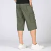 Mäns shorts sommar med flera fickor med dragkedja med en crotch casual Bermuda löst passande mäns råvarukorts plus storlek 5xl p230602