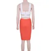 Werkjurken 2 -delige set gebreide 2023 sexy dames wit sleutelgat kruis cross crop top oranje bodycon rok