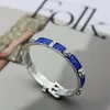 Nuovo 2023 gioielli di design braccialetto collana anello Qi personalità smalto blu testa cintura ad incastro coppia braccialetto
