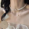 Hafif lüks inci kolye kadın ins niş tasarım aşk kalp püskül köprücük kemiği zinciri çok yönlü high-end anlamda kelebek kolye