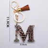 Nyckelringar akryl leopardtrycksbrev Tassel nyckel kedja 26 A-Z Inledande hänge med ring för kvinnor handväska charm tillbehör