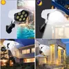 Draagbare lantaarn 77 LED Solar Tuinverlichting Bewegingssensor Simulatie Camera Lamp Outdoor IP65 Waterdicht 3 Mode Solaring Licht Rotatie Spotlight Straat Tuin