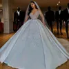 Abiti da sposa lussuosi con paillettes e cristalli arabi Abito da ballo 2021 Maniche lunghe trasparenti Bling Sparkly Dubai Abiti da sposa da giardino Corte 2698