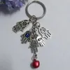 50 Pçs Moda Chaveiro DIY 25mm Chaveiro Turquia Blue Eye Evil Cabala Fatima Hamsa Hand Bell Charms Chaveiro Bolsa Decorativa Presente 185J