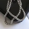 Роскошный дизайнерский треугольник кросс -кузов сумочка Lady Clutch Coil Swork Womans Классическая буква глянцевые патентные кожаные цепочки сумки для наушников 060701