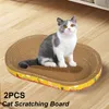 Graffi 2pcs gatto graffiatura protezione mobili macinare giocattoli artigli ovali ondulati di carta ondulata nido gatto forniture gatti
