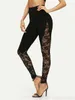 Leggings femmes Sexy taille haute Leggings en dentelle noire femmes dames dentelle florale panneau latéral découpé Leggings noirs S-2XL