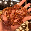 Groothandel Elastisch Touw Kleurverloop Onregelmatige Baltische Natuurlijke Amber Baby Tandjes Armband Amber Natuursteen Sieraden