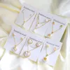 Set di collana con pendente in orecchino in acciaio inossidabile di moda coreana Set di perle Set di gioielli in zirconi cubici per le donne che si sposano all'ingrosso