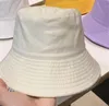 Czapki kulkowe czapki kasetowe mody mgły skąpe brzegi czapki mężczyzna designerowie unisex sunhat rybakowie czapki haftowe odznaki oddychające swobodne wysokiej jakości