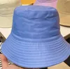 Czapki kulkowe czapki kasetowe mody mgły skąpe brzegi czapki mężczyzna designerowie unisex sunhat rybakowie czapki haftowe odznaki oddychające swobodne wysokiej jakości