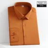 Chemises décontractées pour hommes de haute qualité chemise bleue sans couture grande taille hommes à manches longues coupe ajustée bouton élastique sans repassage affaires garçons formels