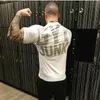 Diseñador masculino Deportes Marca de moda Muscle Fitness Brother Camiseta deportiva de manga corta Transpirable Estiramiento Hombres Ropa deportiva informal al aire libre